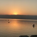 early morning sunrise on Galilee swimmers