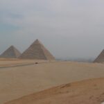 The three great pyramids of Giza with modern Giza in the background