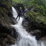 rapeling down waterfall